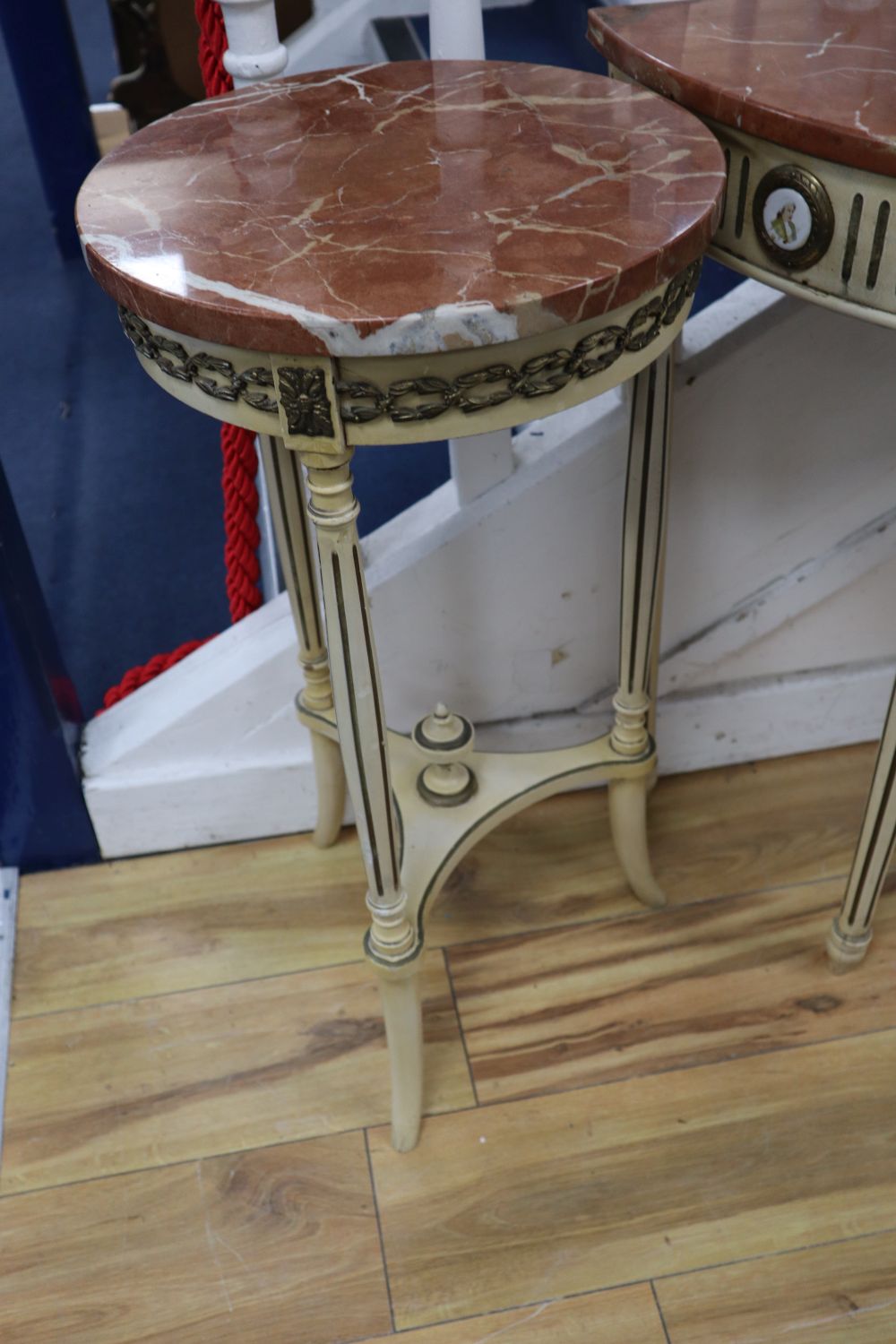 A pair of parcel gilt cream painted occasional tables with rouge marble tops and a similar demi-lune table with cracked marble top